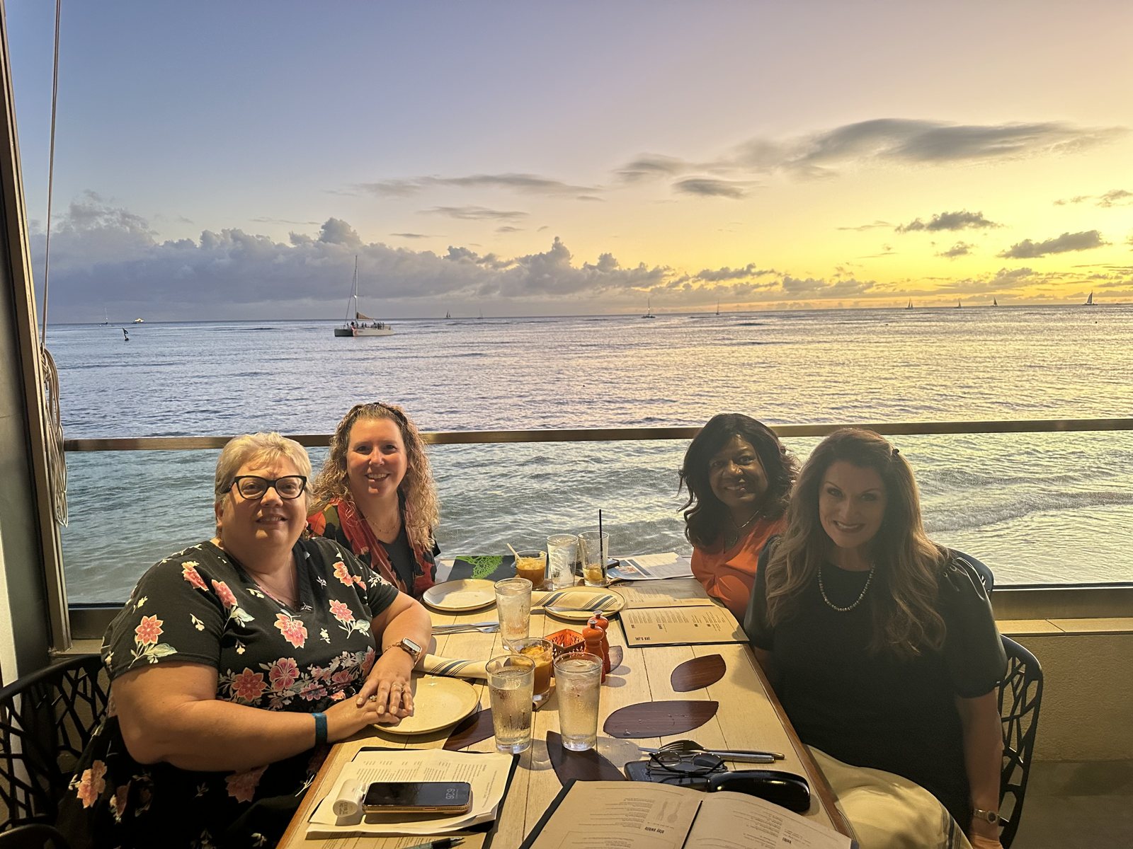 Kristi with a group of travel advisors at dinner in Hawaii